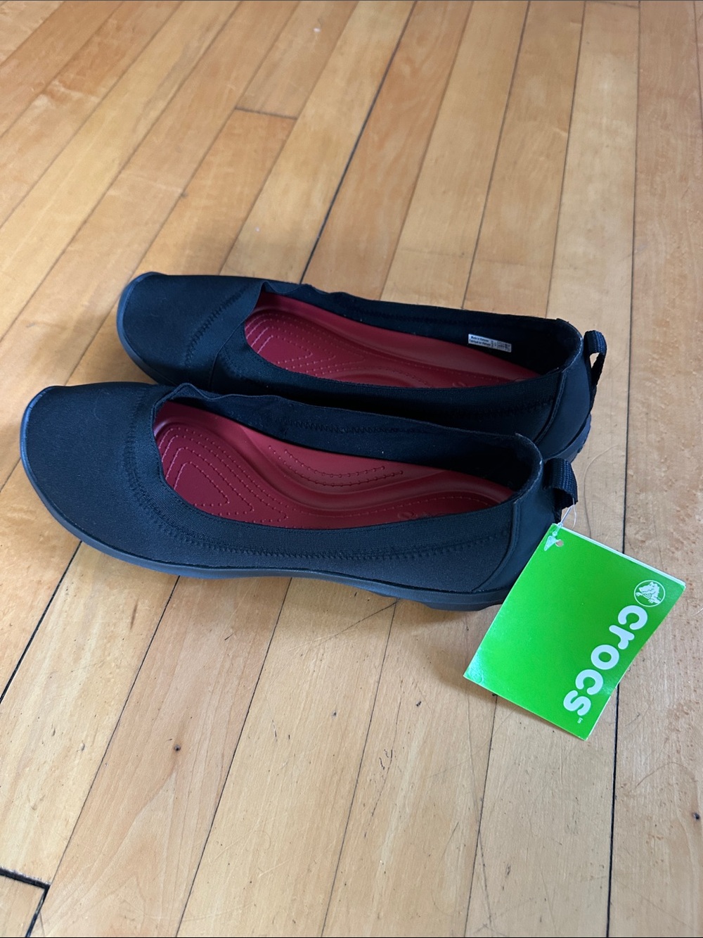CROCS Women's Black Slip-On Flats with Red Insole